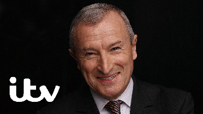 Sports presenter Jim Rosenthal smiling.