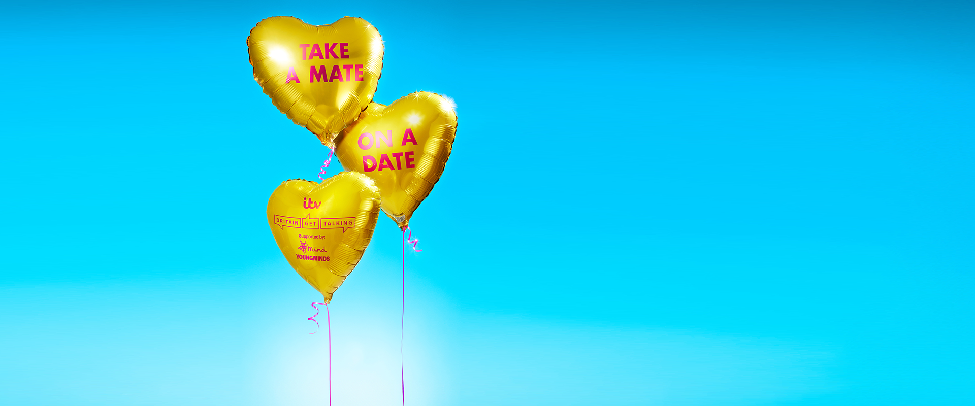 Three gold heart balloons tied by pink ribbon. On the balloons, it reads 'Take a Mate on a Date'. The Britain Get Talking logo is on the bottom heart balloon supported by Mind and YoungMinds.